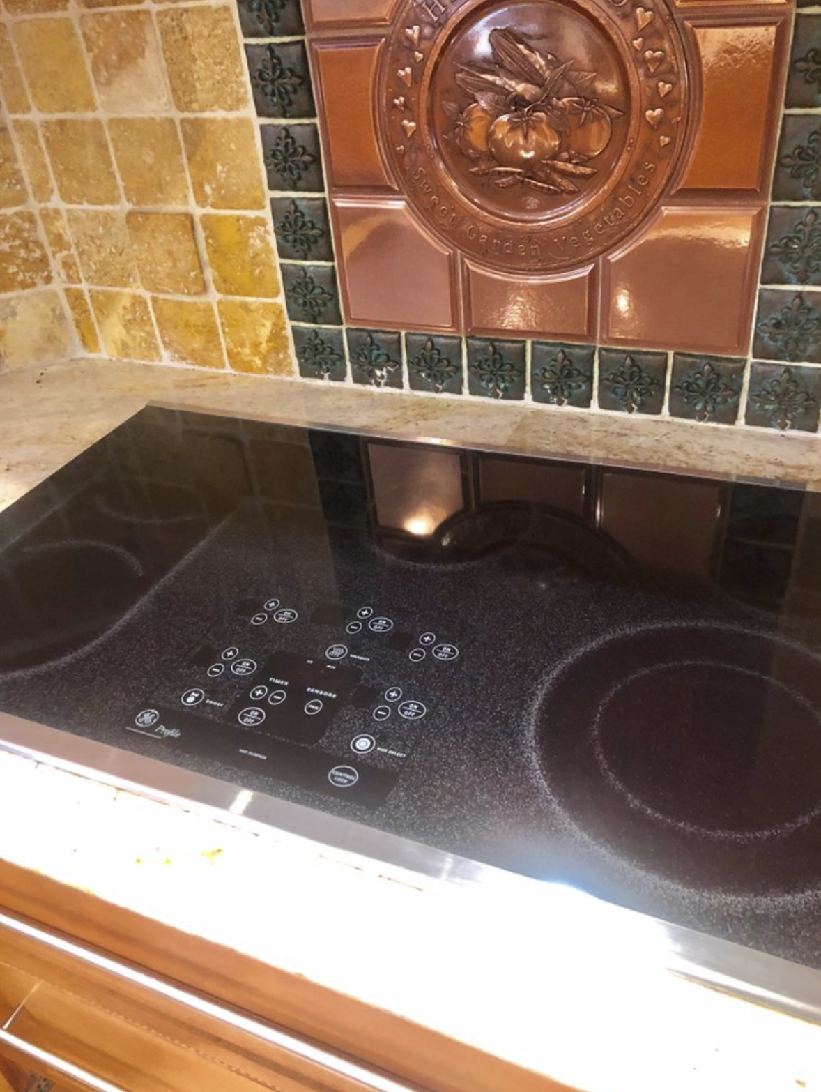 GE Profile glass cooktop service and touch controls diagnosis on Long Island